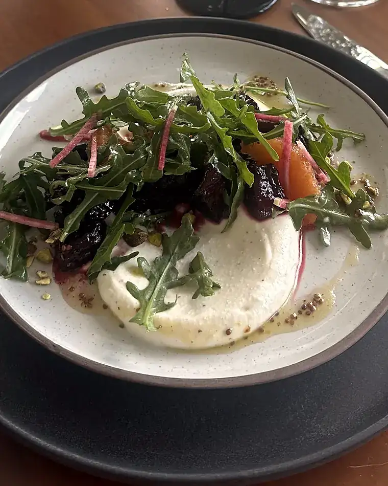 Salt-baked beets with whipped goat cheese, arugula and marcona almonds